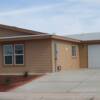 Here is a beautiful front porch home with a garage in Casa Grande, AZ.